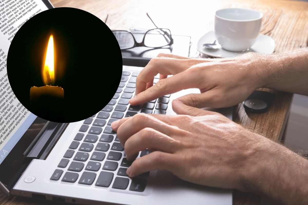 persona alla tastiera e candela luce