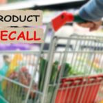 donna al supermercato e scritta